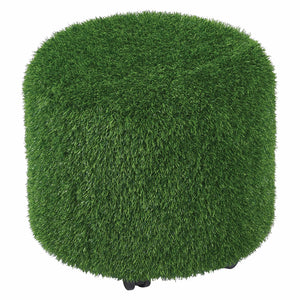 Front product view of the MTA Essentials Aalto Round Grass Ottoman against a clean white background. The compact round seat is fully covered in dense green artificial grass style material, with subtle black castors visible beneath the base, showcasing its distinctive sensory texture and practical mobile seating design.