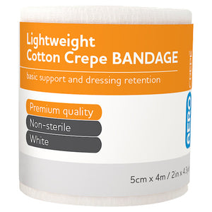 Roll of lightweight cotton crepe bandage with an orange and white label printed basic support and dressing retention, premium quality, non-sterile, white, 5cm x 4m