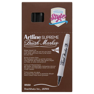 Front of an Artline Supreme Brush Marker box with black markers showing through the window