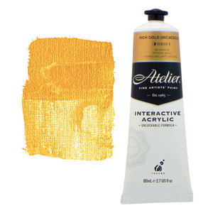 Chroma Atelier Interactive Acrylic Paint 80ml Rich Gold (Micaceous): tube with a gold colour band beside a painted swatch of a warm, deep yellow gold with sparkle