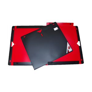 Colby Art 751A1 fold-out folio with black exterior and red interior, shown closed with a die-cut handle on top of the opened folio