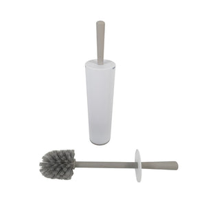 White tapered Compass toilet brush holder with a grey handle standing in it and the grey round headed brush with a white disc lying in front