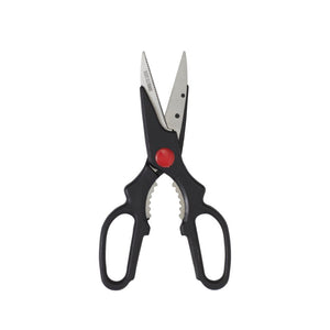 Connoisseur kitchen scissors standing upright with stainless steel blades, black loop handles, a red pivot and ridged nutcracker teeth