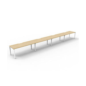 Rapidline Deluxe Infinity single sided profile leg workstation, pod of four desks with Natural Oak tops, White Satin base, angled view from the front left on a white background