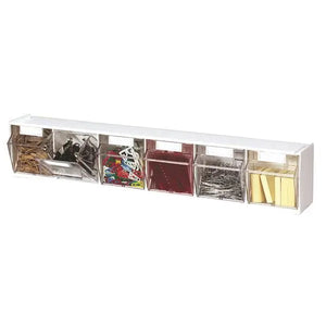 White desk organizer with compartments holding office supplies on a white background