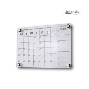 Deflecto A4 acrylic wall planner on a white wall, showing the printed month tick row from January to December, the Monday to Sunday monthly grid and the This Week column, held on four chrome standoff fixings.