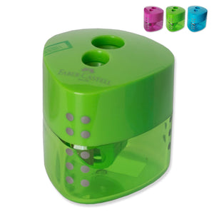 Faber-Castell Grip double hole pencil sharpener in green with two holes, raised grey grip dots and translucent shavings reservoir, with pink and blue versions shown