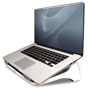 Silver laptop open on the white Fellowes I-Spire laptop lift, angled toward the viewer with the grey inner surface underneath