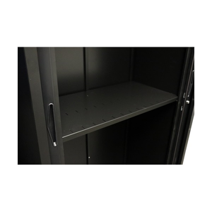 Close view of a black Go slotted shelf inside a black tambour cupboard, showing the slotted surface and door edges