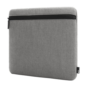 Incase Carry Zip Sleeve for 13-inch laptops in Cement Gray, angled three-quarter view, studio cut-out on a plain background