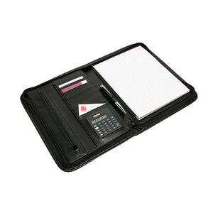 The black Marbig R90087 pad holder open at an angle, with card slots and a calculator on the left, a pen in its loop and a lined pad on the right
