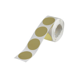 Roll of QuikStik 24mm gold removable circle labels partly unwound on white backing paper