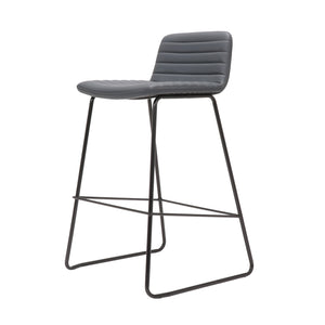 Rapidline Pixel bar high stool in French Navy PU on a black powdercoated tall sled base with a foot rail, product photograph on a plain background showing the ribbed horizontal stitching across the seat and back.