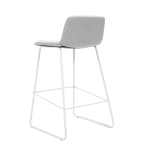 Rapidline Pixel bar high stool in light grey commercial fabric on a white powdercoated tall sled base with a foot rail, product photograph on a plain background showing the ribbed horizontal stitching across the seat and back.