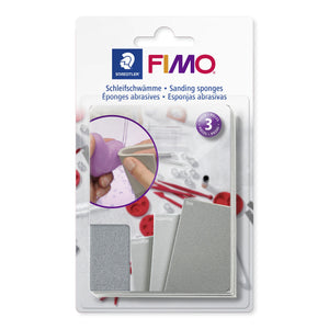 Current FIMO sanding sponges blistercard in white with a purple heart being sanded on the front and a badge showing three sponges