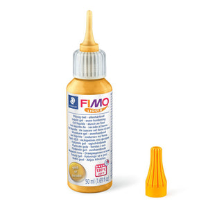 FIMO liquid 8050-11 gold 50 ml bottle with the cap removed to show the dosage nozzle, the orange cap standing beside it and a gold panel on the label