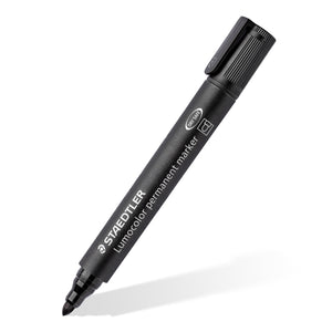 Black Lumocolor 352 permanent marker with cap on, lying at an angle with the STAEDTLER name along the barrel
