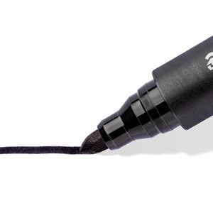 Close-up of a black Lumocolor permanent 352 bullet tip drawing a thick line, Staedtler range photo