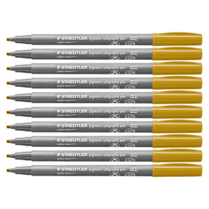 Row of ten Staedtler 375 calligraphy pens with golden ochre caps on grey barrels, chisel tips aligned on the left