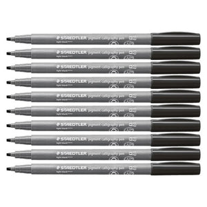 Ten Staedtler 375 pigment calligraphy pens in light black lying in a row, grey barrels with black caps and chisel tips pointing left