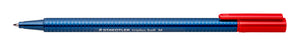 Staedtler triplus ball 437 M red ballpoint pen photographed flat, red cap posted at the end and the metal point of the blue dotted barrel visible