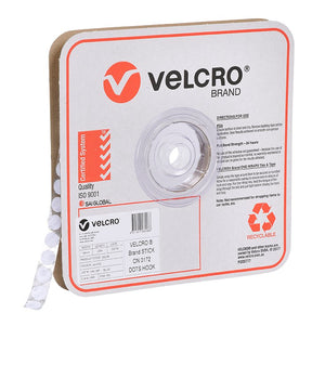 Velcro Brand V28206 16mm white stick on hook spots on a roll in a square Velcro Brand box, angled view with white spots running out of the box, with the red Velcro logo, a product label and a recyclable mark on the front