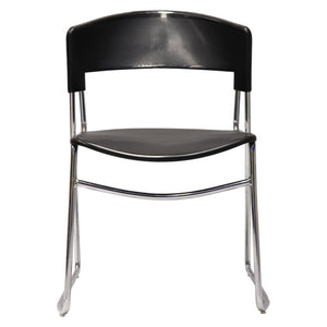 Rapidline Zola stacking chair seen from the front, with curved black PVC back, black seat and chrome sled base.