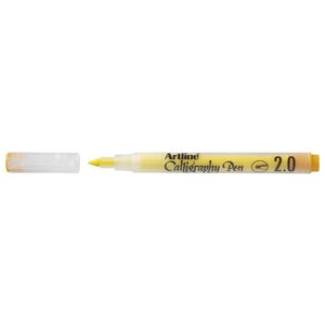 Artline Calligraphy Pen 2.0 in pastel yellow with the cap removed beside it