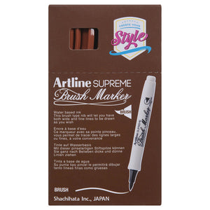 Front of an Artline Supreme Brush Marker box with brown markers showing through the window