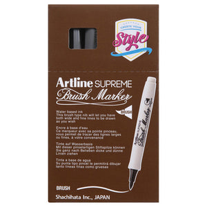 Front of an Artline Supreme Brush Marker box with grey markers showing through the window