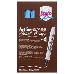Front of an Artline Supreme Brush Marker box with light blue markers showing through the window