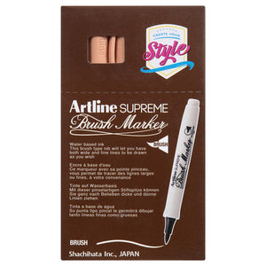 Front of an Artline Supreme Brush Marker box with apricot markers showing through the window