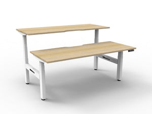 Rapidline Boost Plus electric height adjustable back to back workstation, E0 rated Natural Oak top on a white satin powdercoated frame. Rapidline range image supplied for model B+2P1875 NO/WS.