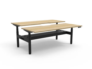 Rapidline Halo Plus electric height adjustable back to back workstation on 70mm diameter round columns, E0 rated Natural Oak top with a black satin powdercoated frame, fitted ducted cable tray. Rapidline range image supplied for model H+2PCT1275 NO/BL.