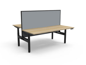 Rapidline Halo Plus electric height adjustable back to back workstation on 70mm diameter round columns, E0 rated Natural Oak top with a black satin powdercoated frame, 900mm black fabric privacy screen. Rapidline range image supplied for model H+2PWS1275 NO/BL.