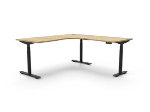 Rapidline Halo Plus electric height adjustable corner workstation on 70mm diameter round columns, E0 rated Natural Oak top with a black satin powdercoated frame. Supplied product image for model H+CNR1P1818 NO/BL.