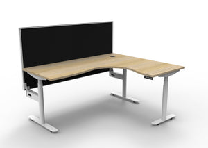 Rapidline Halo Plus electric height adjustable corner workstation on 70mm diameter round columns, E0 rated Natural Oak top with a white satin powdercoated frame, 900mm black fabric privacy screen. Supplied product image for model H+CNRWS1P1815 NO/WS.