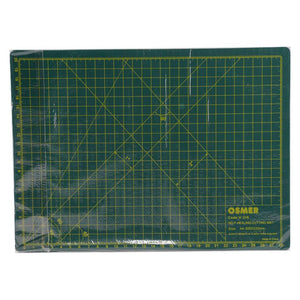 Osmer A4 self-healing cutting mat 30 x 22cm in dark green, top view in its clear shrink wrap showing the grid and angle lines