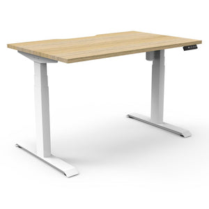 Rapidline Boost Light single sided electric sit-stand desk with a natural oak top on a white frame, with the controller at the front right edge