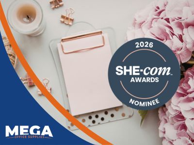 Mega Office Supplies 2026 SHE-com Awards nominee badge with stationery items and floral background celebrating Craft & Stationery Brand of the Year nomination