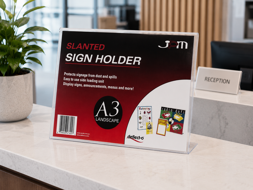 A3 slanted sign holder displayed on a bright reception counter with clear acrylic frame, printed insert and professional office styling.