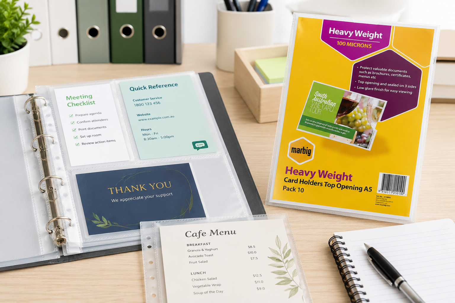 A5 sheet protectors arranged on a bright office desk with compact binder pages, menu cards, reference notes and filing stationery.