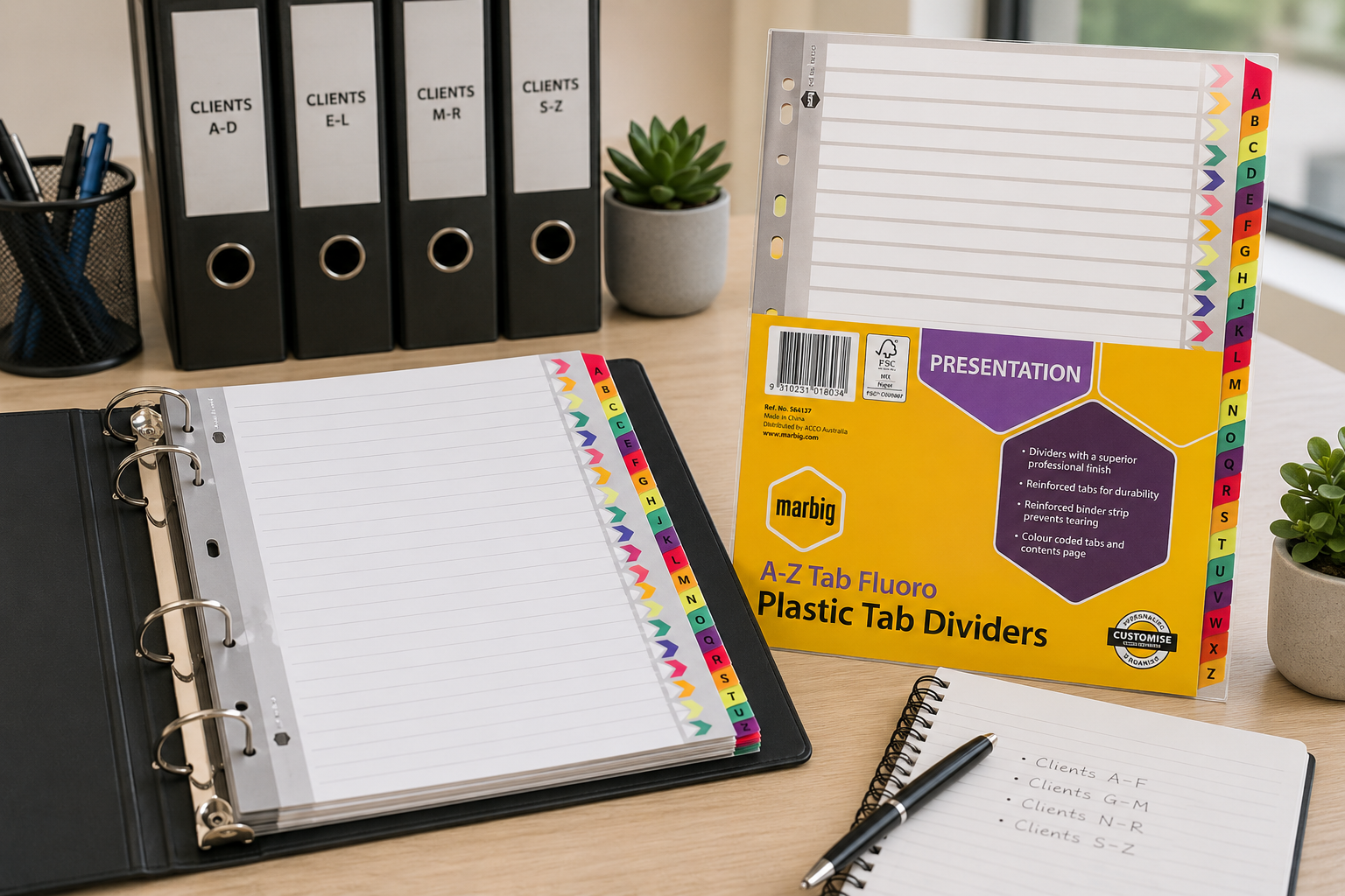 Alphabetical tab dividers arranged in an office binder with A to Z coloured tabs, filing folders and desk stationery.
