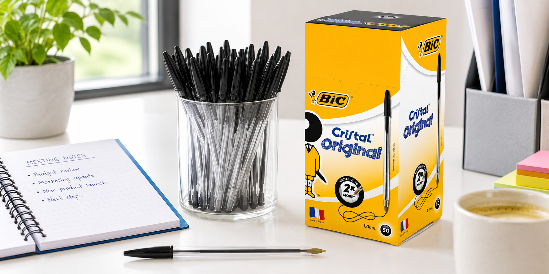Ballpoint pens and BIC Cristal Original box arranged on a bright, organised office desk.