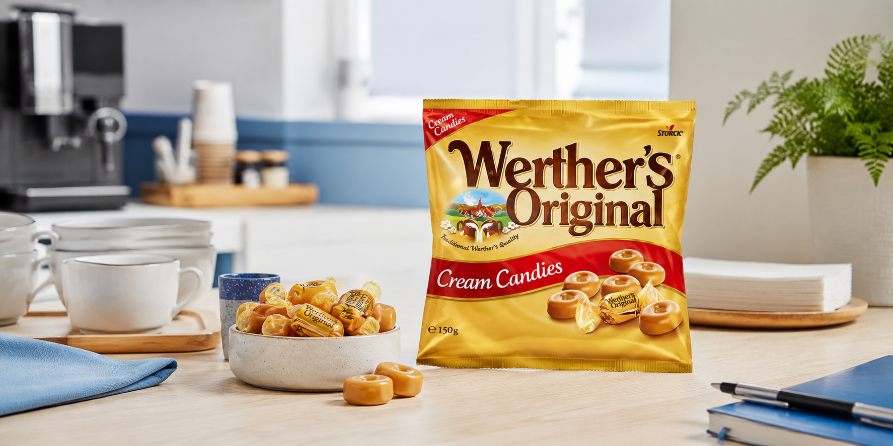 Werther’s Original confectionery pack and candies arranged on a modern staff kitchen counter with cups, napkins and coffee station