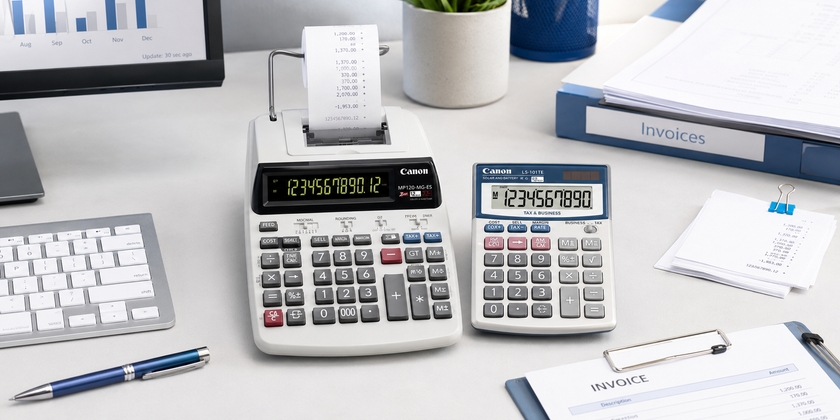 Office calculators on an accounts desk with invoices, receipts and finance paperwork.