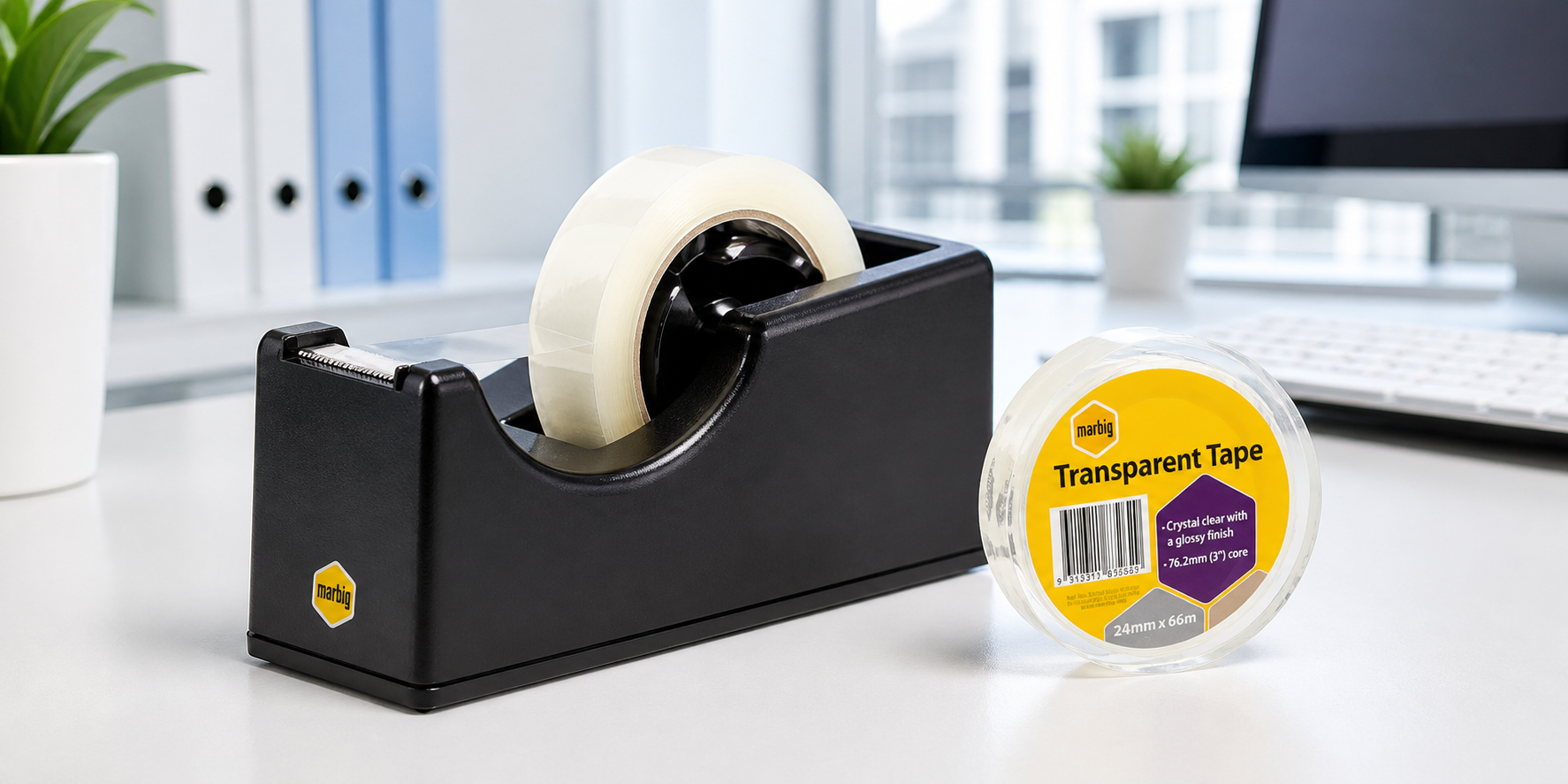 Marbig tape dispenser and transparent office tape on a bright white desk in a modern corporate workspace.
