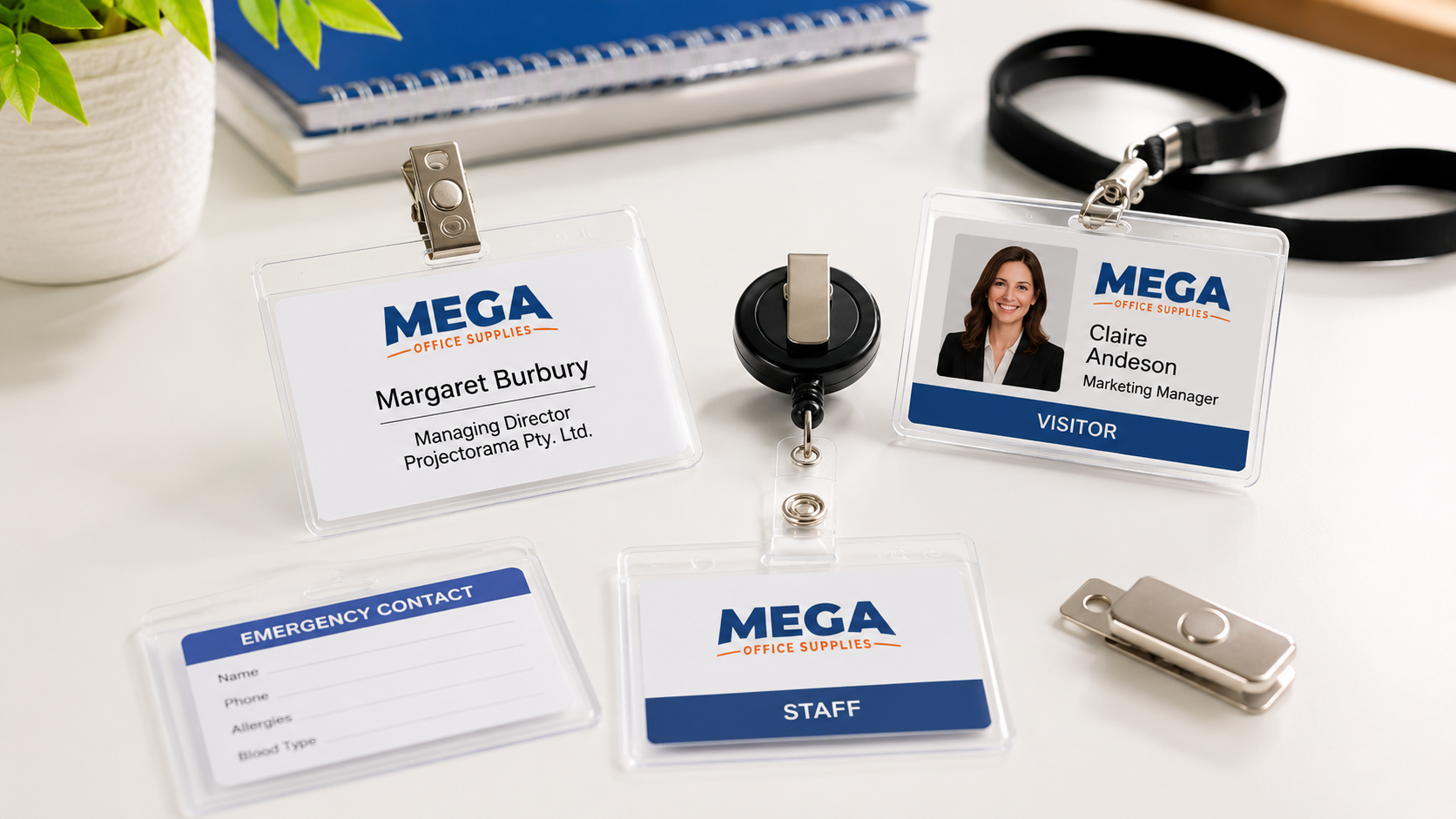 Name badges, ID holders, lanyards and retractable reels arranged on a bright white office desk.