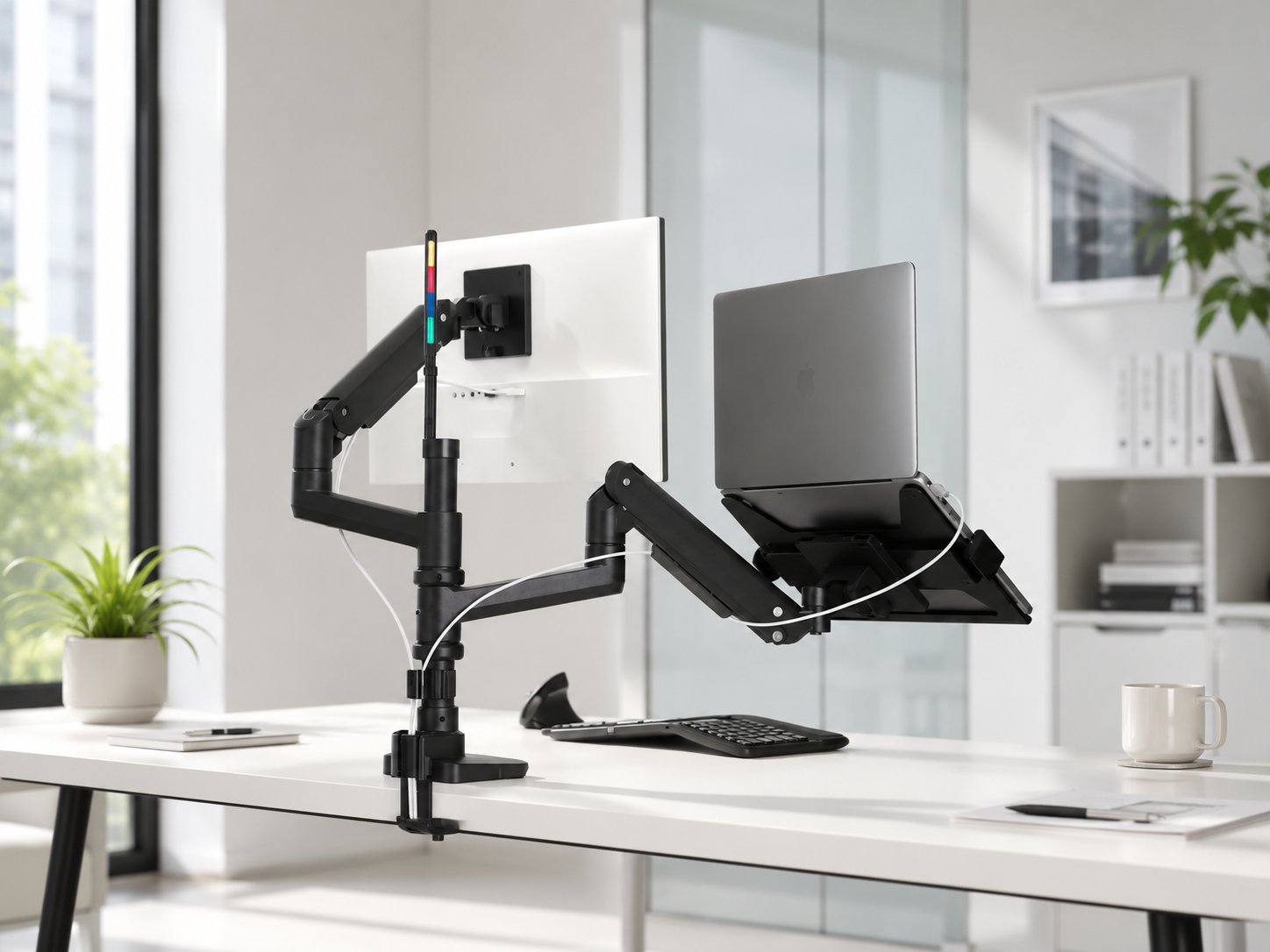 Adjustable monitor and laptop arm mounted to a white desk in a bright modern office workspace.