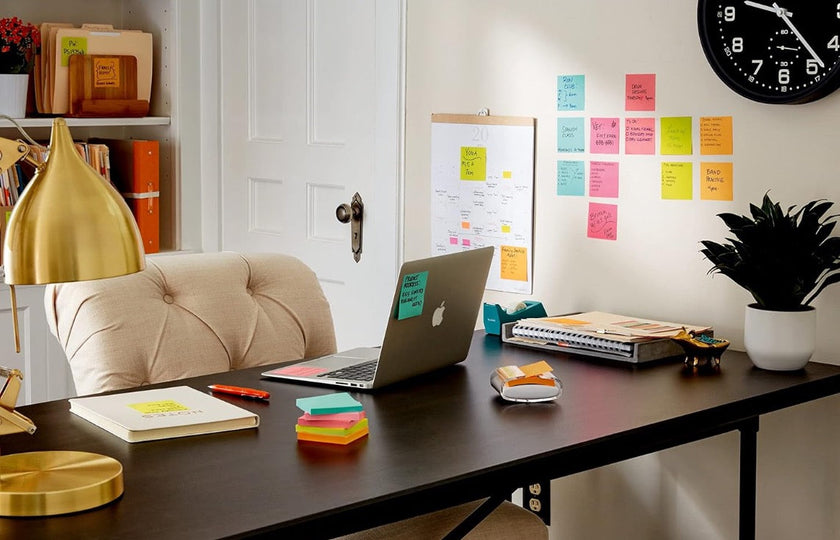 Pop up sticky notes used around an organised admin desk for fast reminders, messages and task tracking.